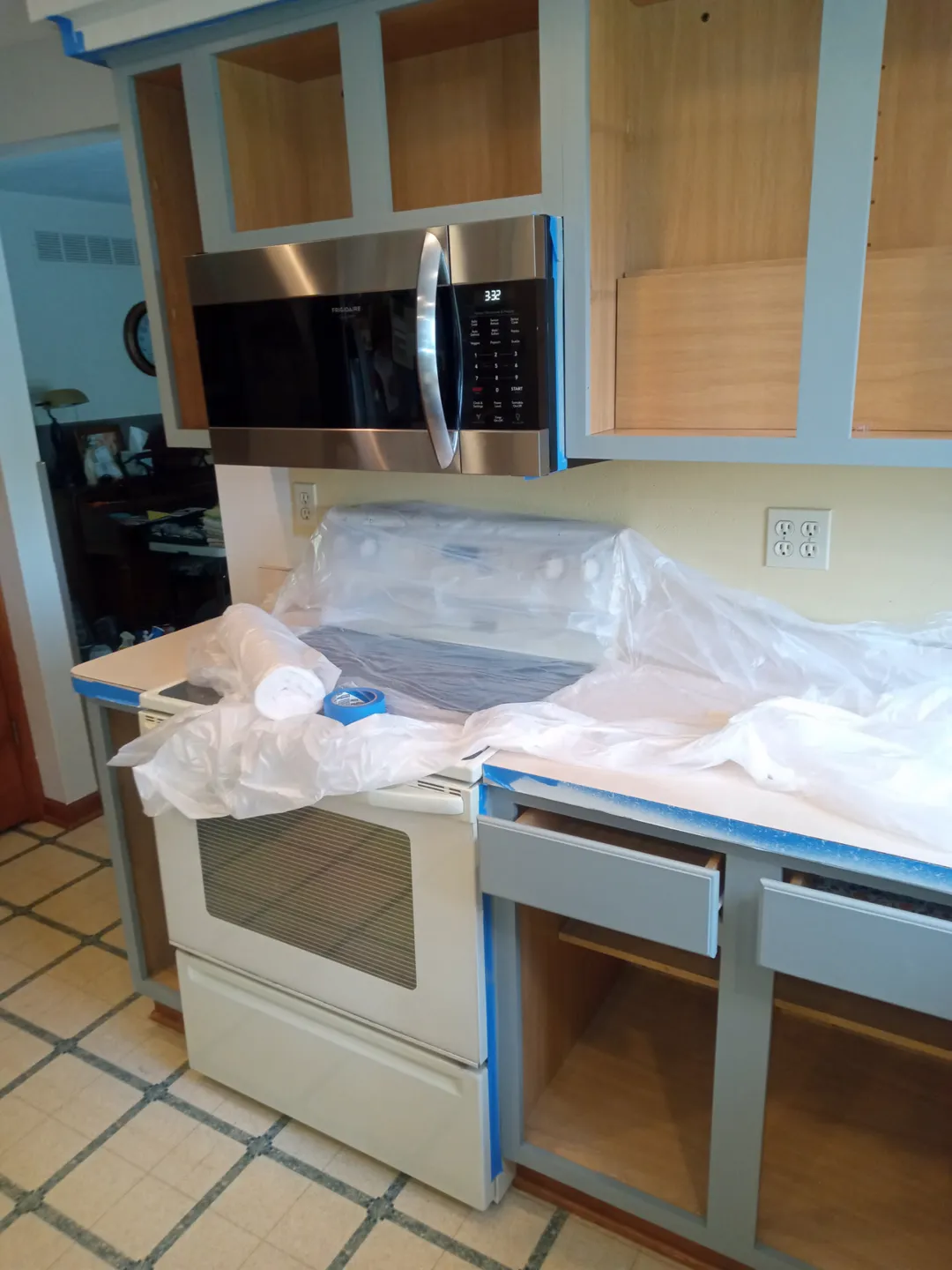 Painted cabinet frames and drawers with the counters covered