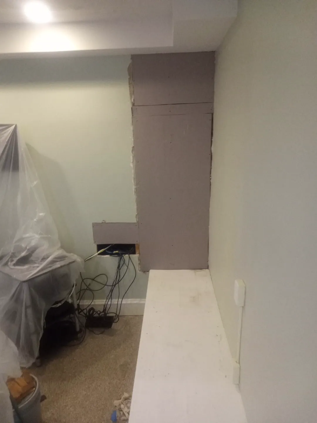 New drywall hung over the opened basement wall